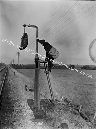 DANGLING MAILBAG WITH WORKER